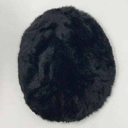 Saks Fifth Avenue black pillbox hat from the 2020s, viewed from the top