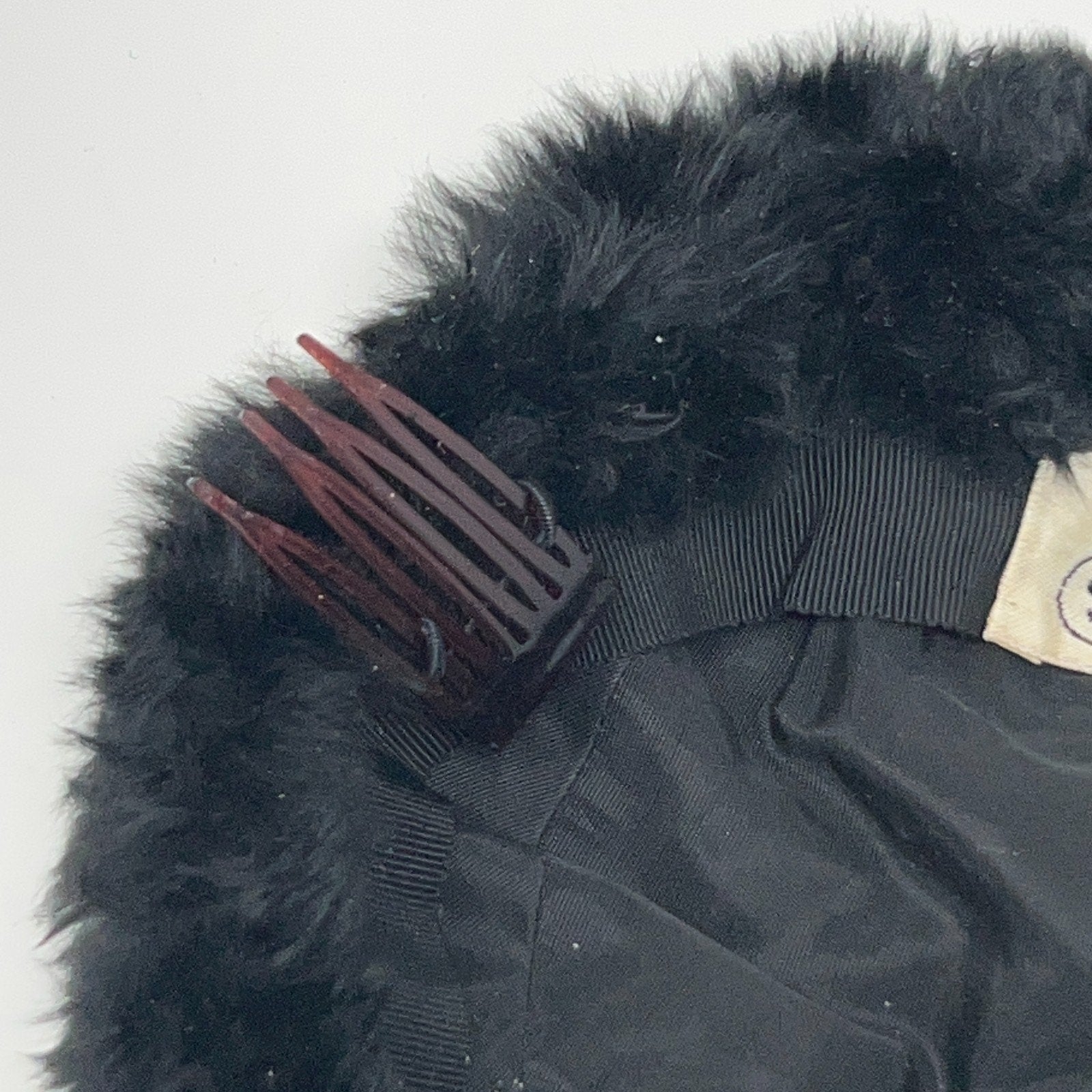 Saks Fifth Avenue pillbox hat in black with a vintage design and front view