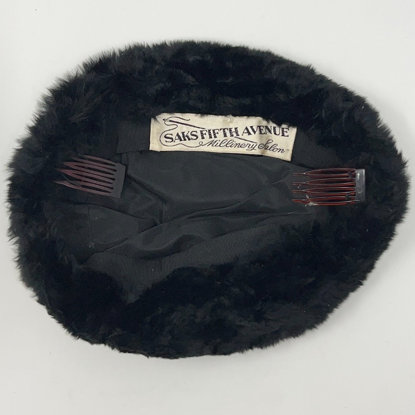 Saks Fifth Avenue vintage black pillbox hat, inside view, with hair comb attachments