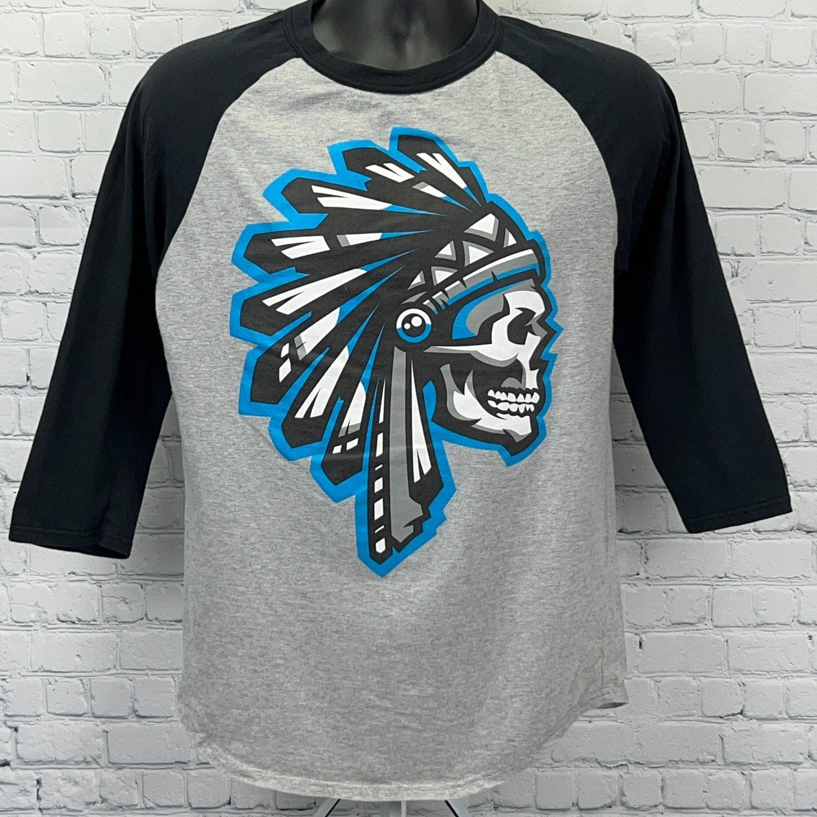 SAVS Gray Baseball T-Shirt with Black Sleeves and Bold Tribal Skull Graphic on Front