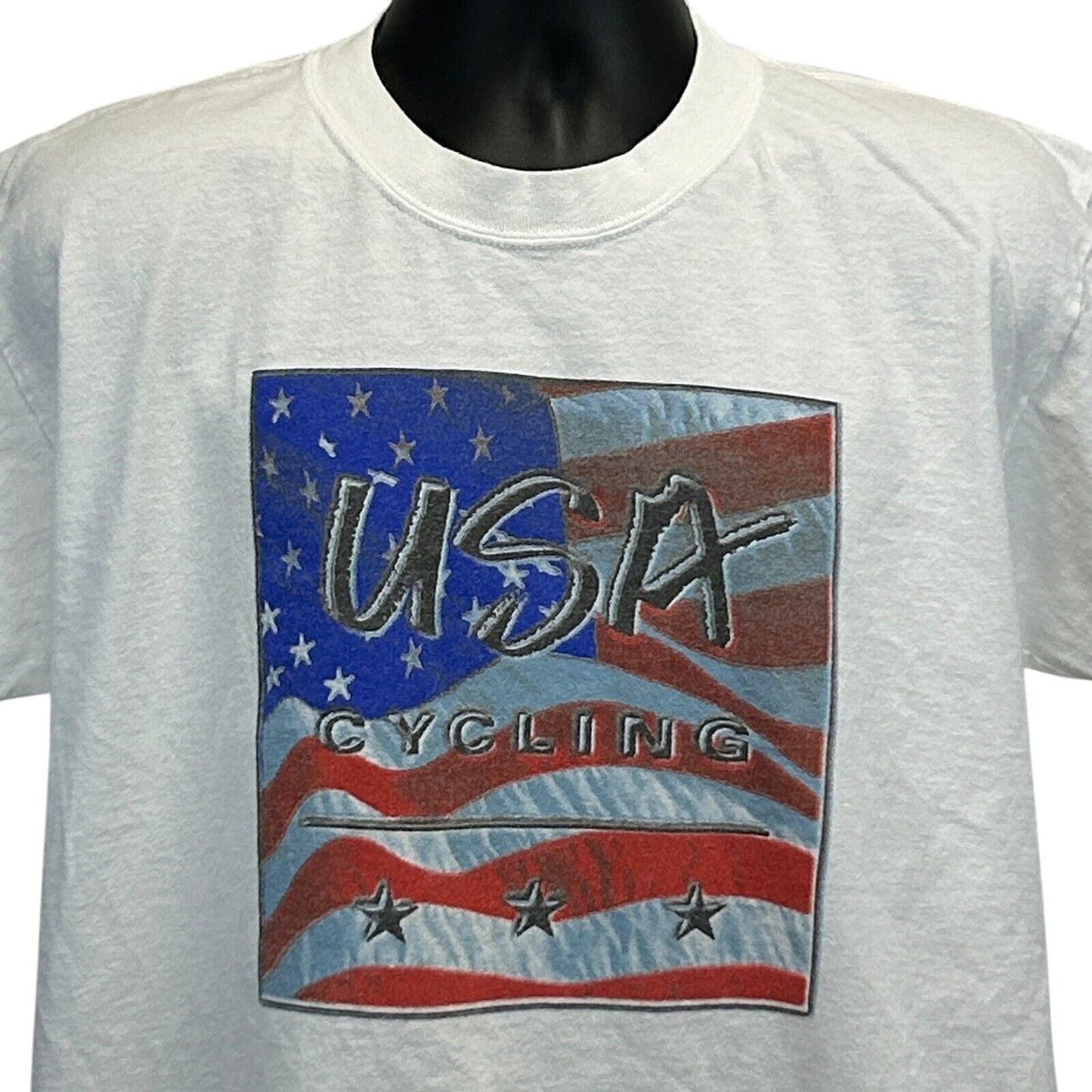 White Gildan T-Shirt featuring a USA Cycling graphic with an American flag design