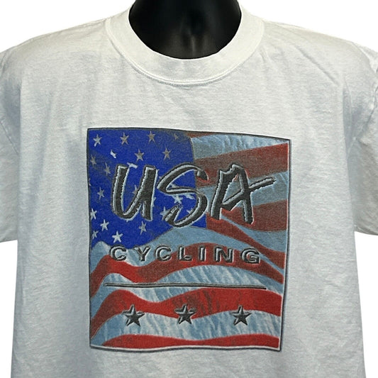 White Gildan T-Shirt featuring a USA Cycling graphic with an American flag design