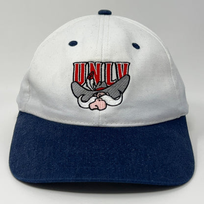White and blue UNLV baseball cap featuring embroidered logo of the school's mascot on the front