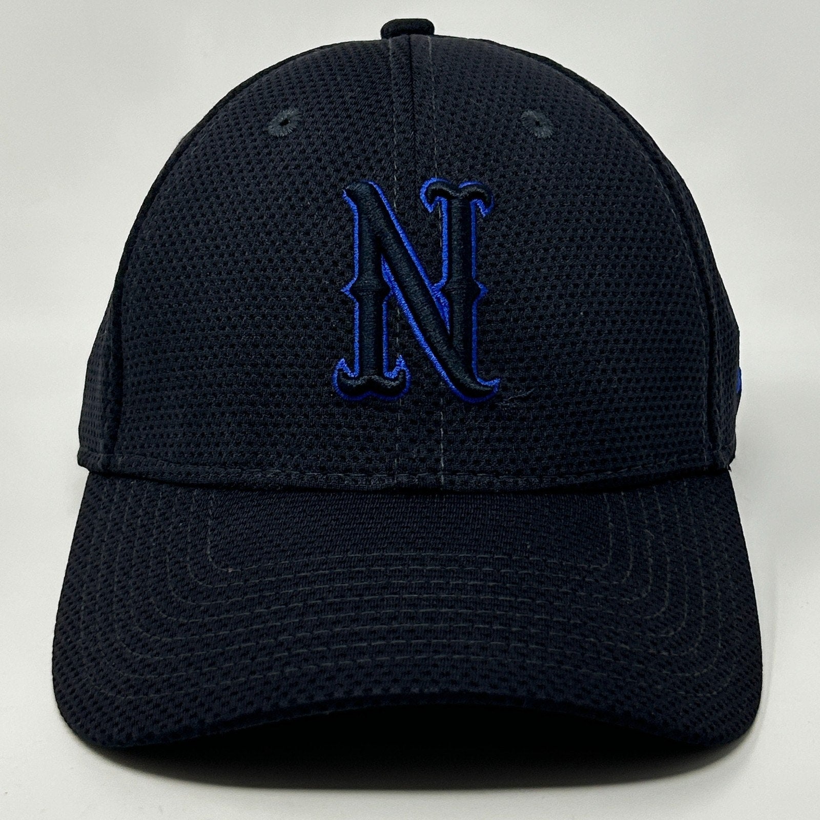 Front view of New Era UNR Hat in navy blue with raised 'N' logo for stylish sportswear