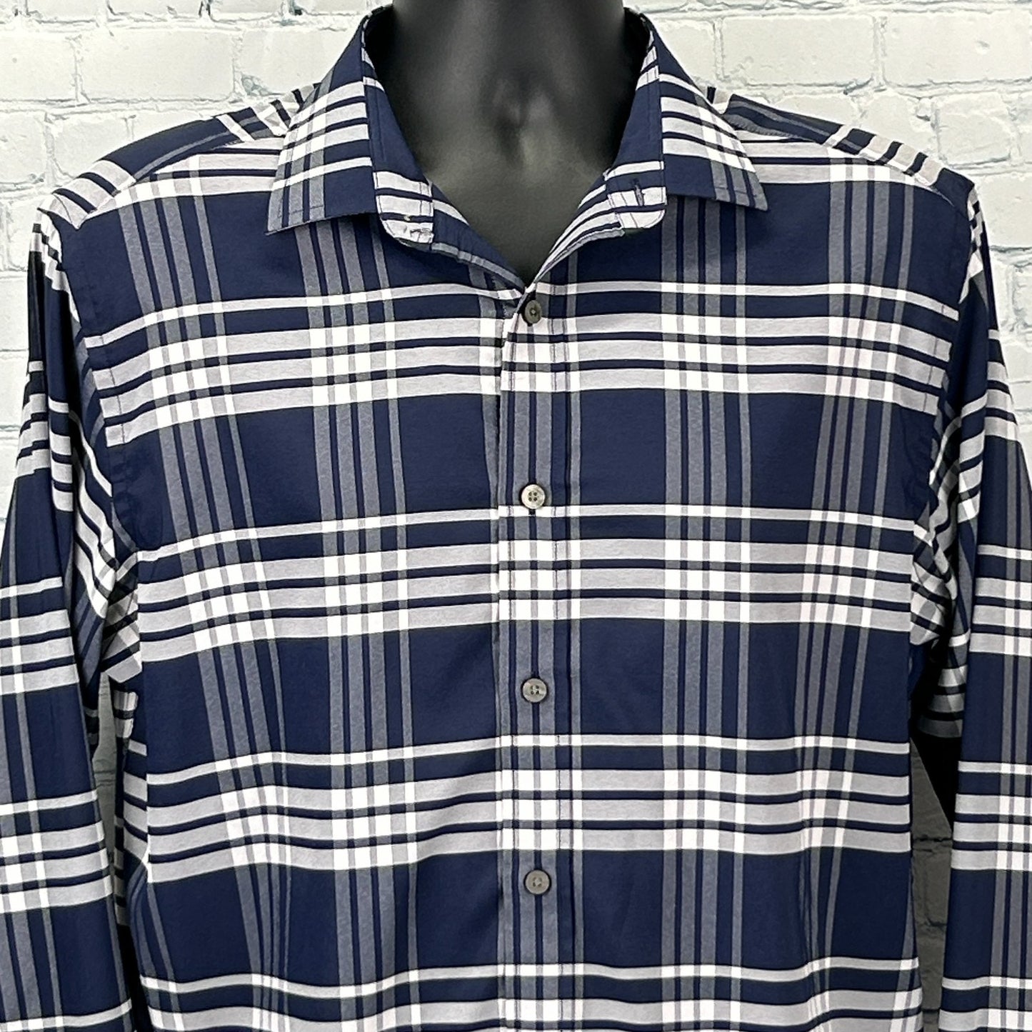 Navy and white checkered UNTUCKit Shirt in size medium displayed from the front with button details
