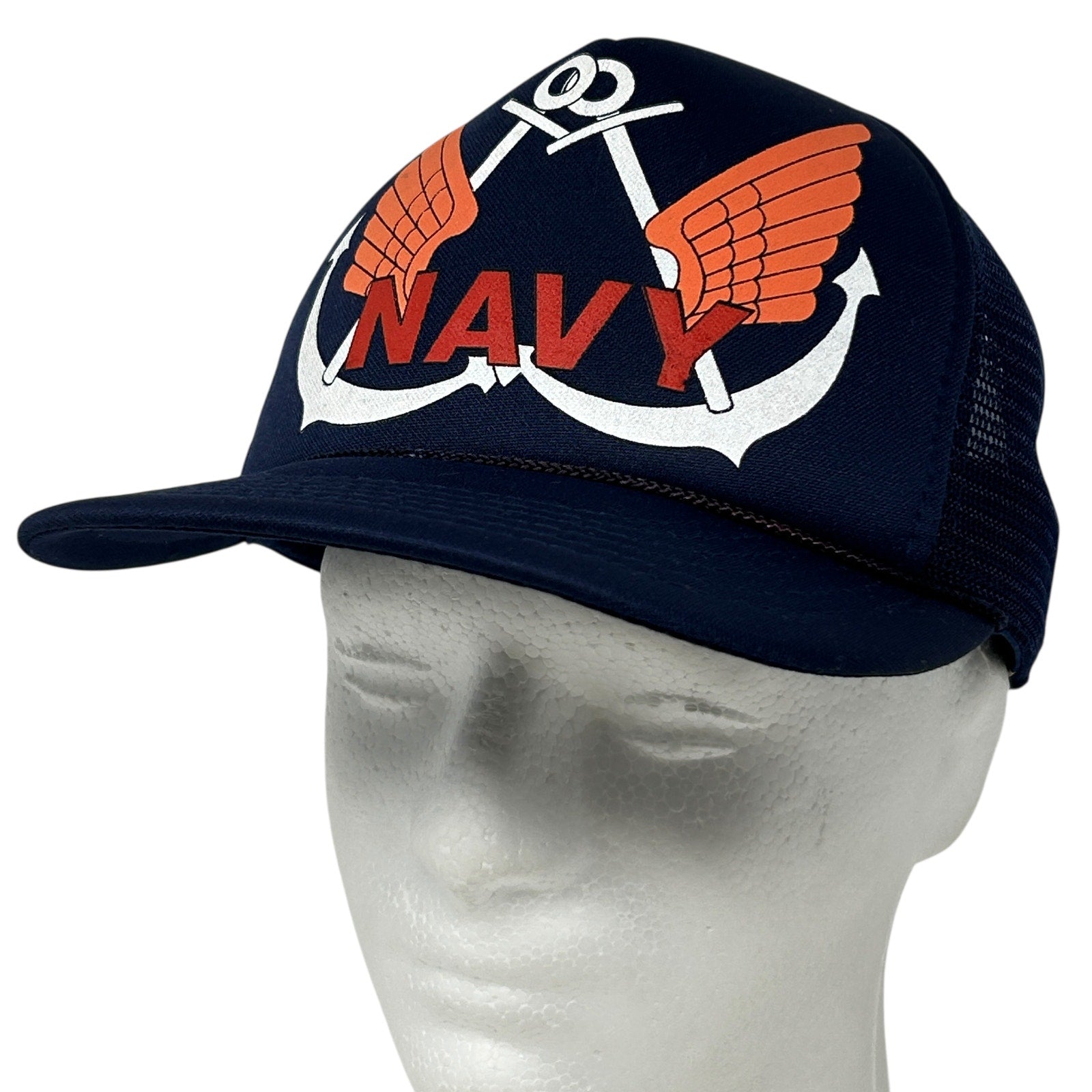 Vintage US Navy navy blue cap with winged anchor logo, adjustable fit, and front view.