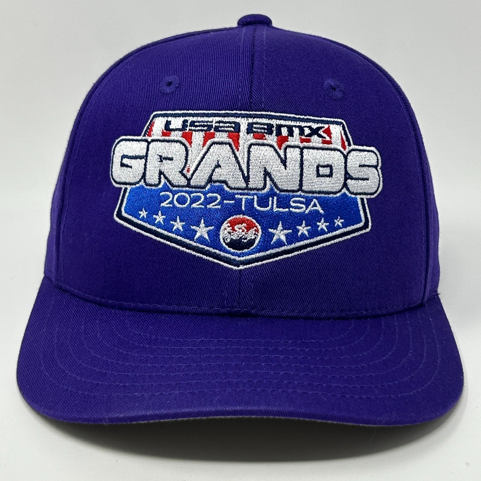 Purple BMX Hat featuring USA BMX Grands logo for 2022 Tulsa event, front view with 2022 detail