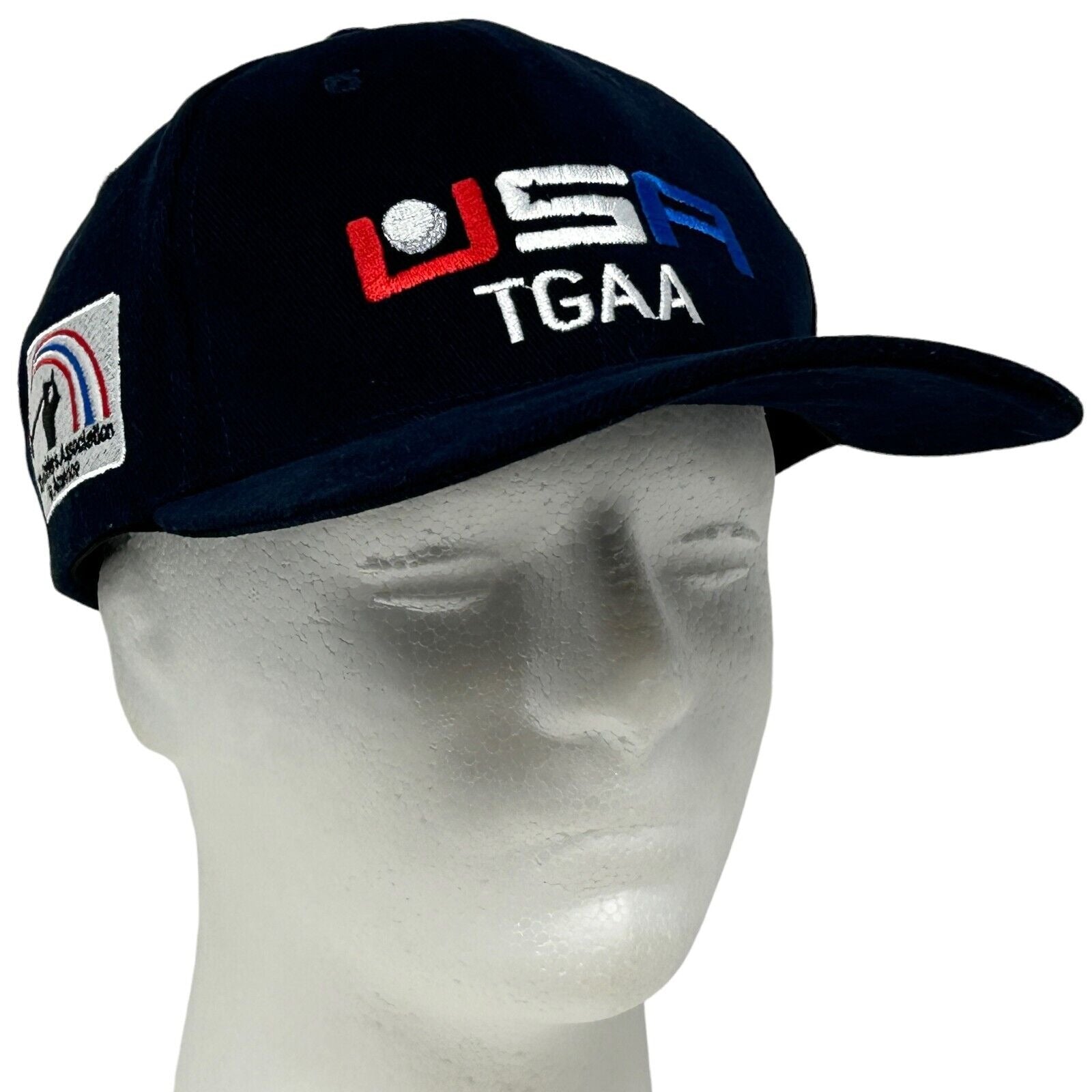 Unbranded navy TGAA cap featuring front USA logo and side embroidery detail