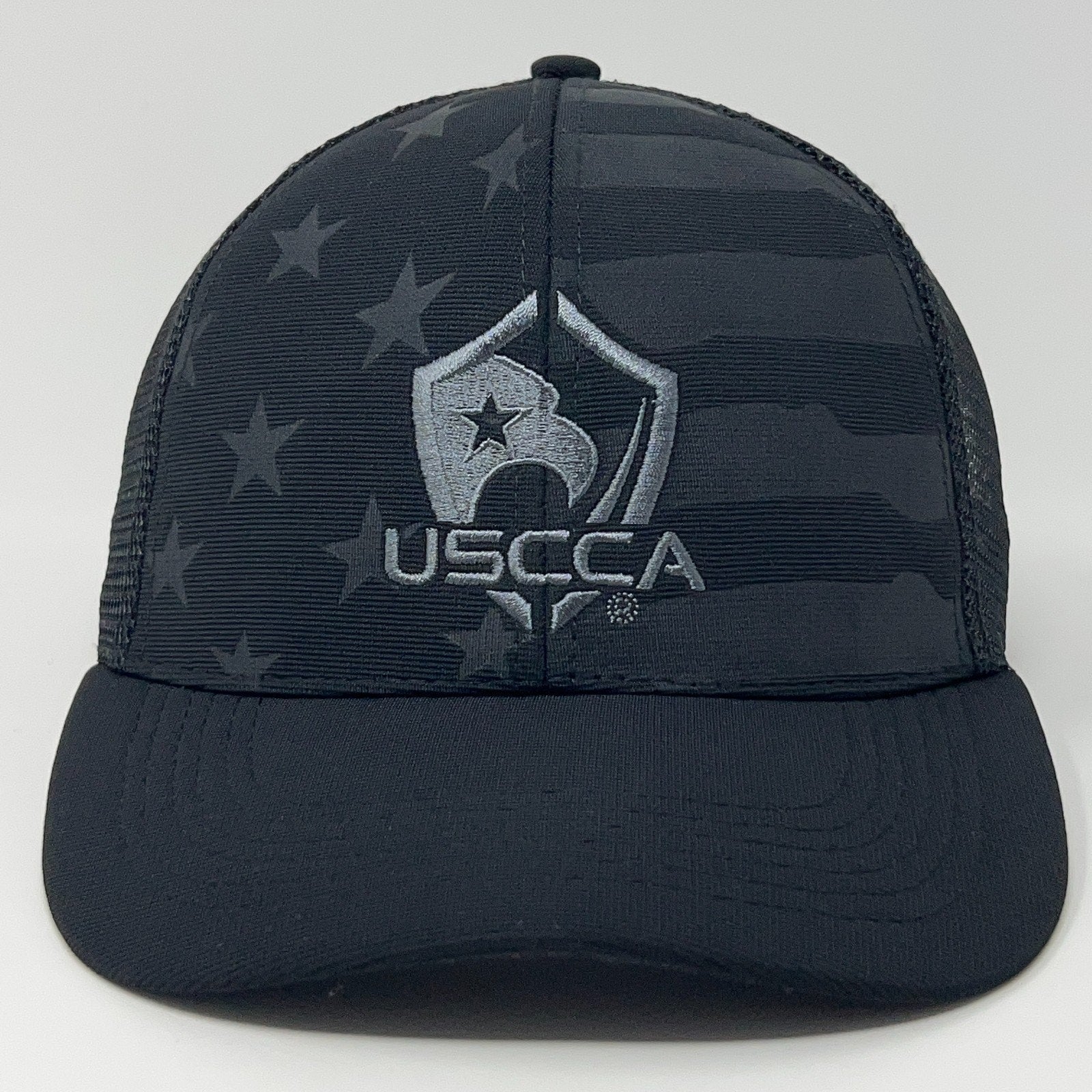 Black USCCA Cap featuring a flag design and embroidered logo on the front for a stylish look