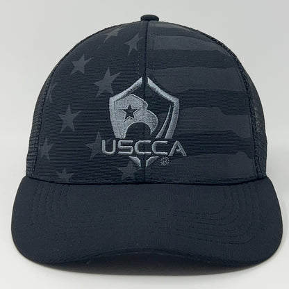 Black USCCA Cap featuring a flag design and embroidered logo on the front for a stylish look