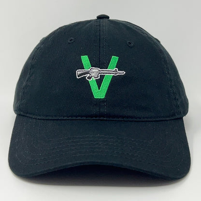 Black cap with green V logo and rifle embroidery, front view, by The Vandals