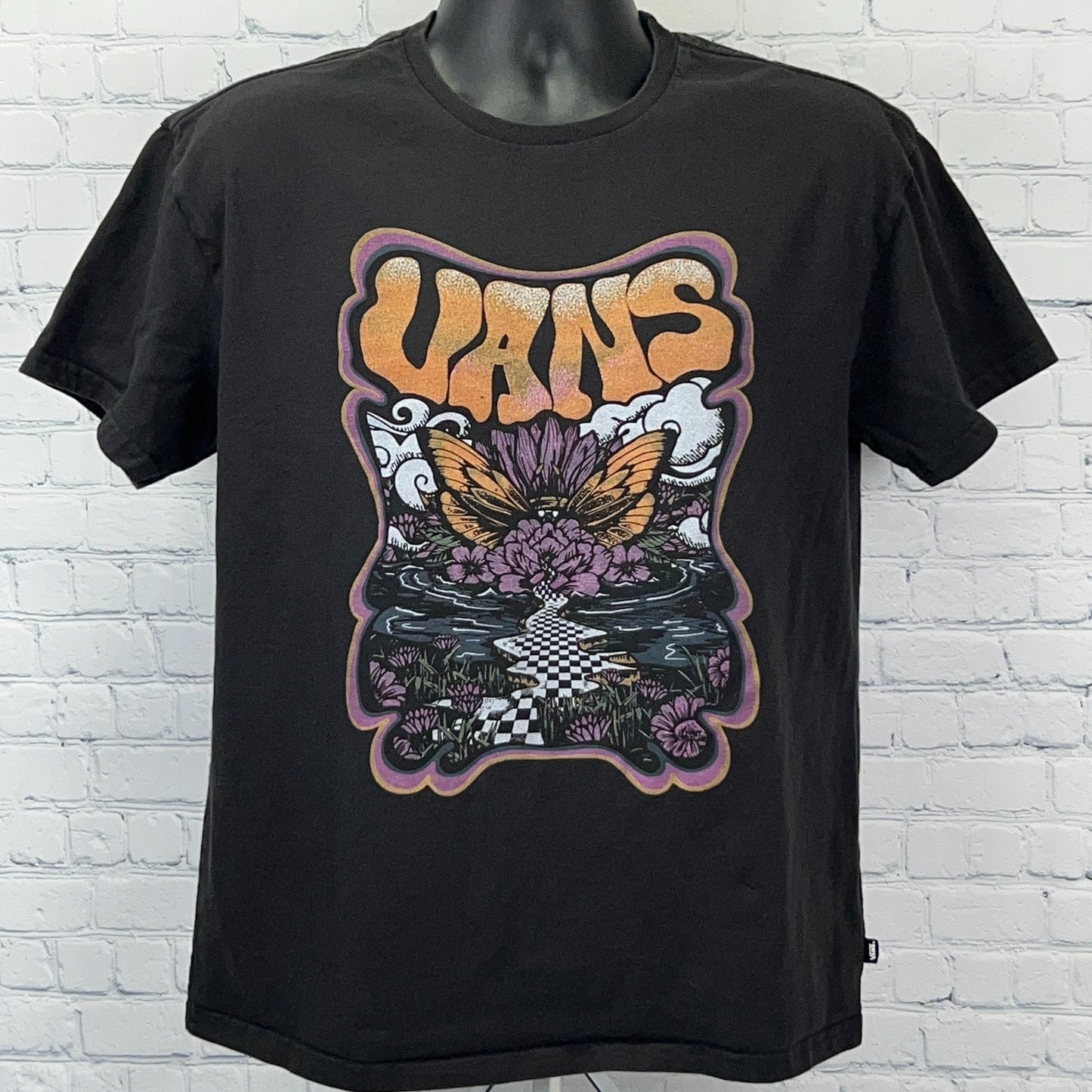 Vans black t-shirt featuring a colorful graphic with butterflies and flowers in front view