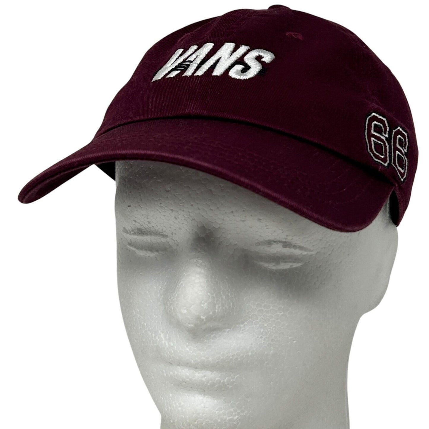 Front view of a burgundy Vans cap featuring white logo and 66 embroidery detail