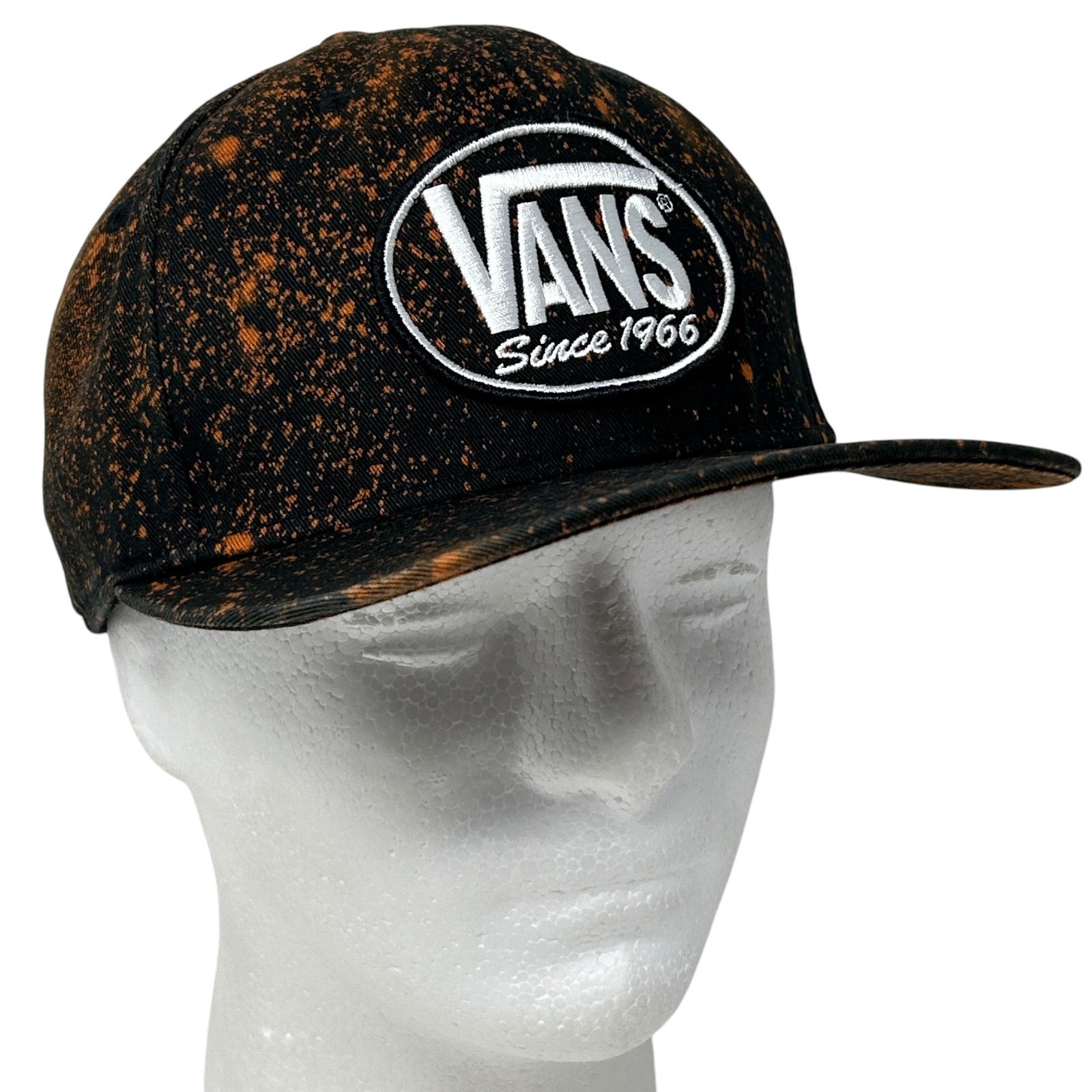 Vans black and orange speckled cap with front logo patch, adjustable fit and classic style