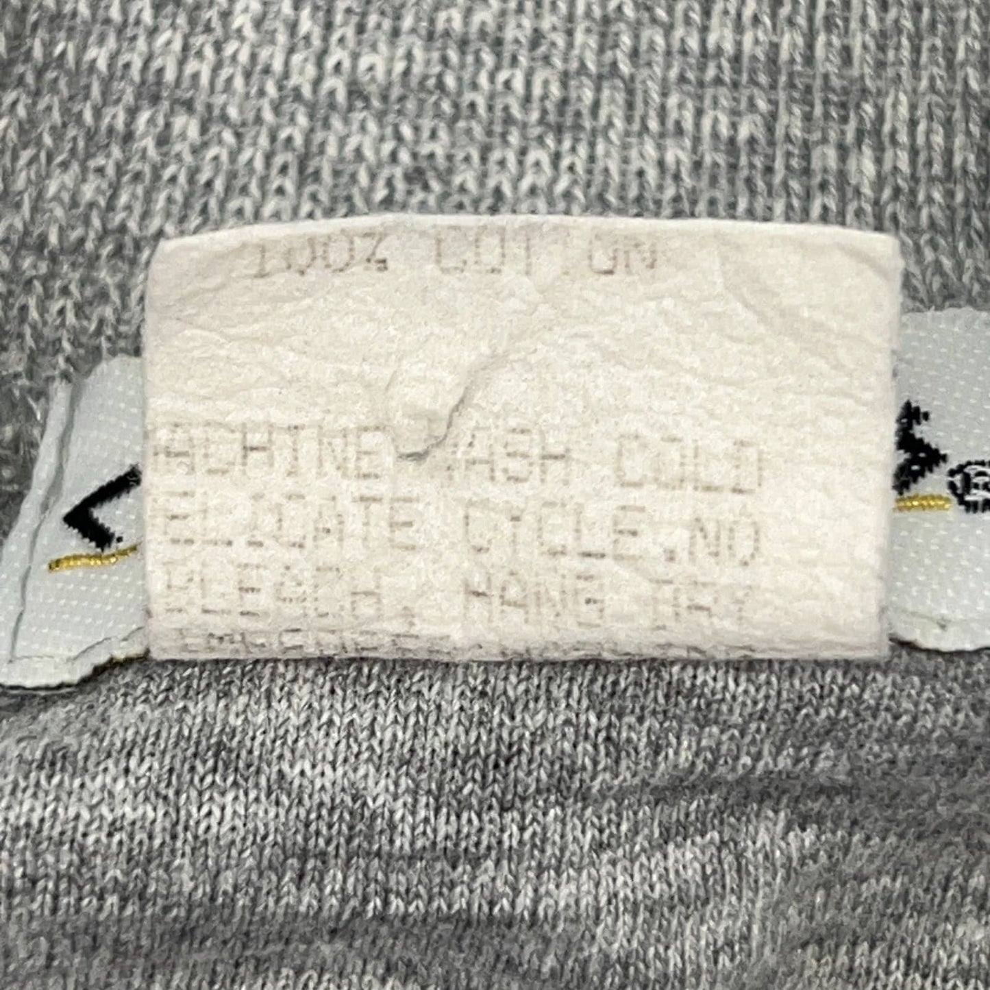 Caesars vintage T-shirt in gray, size large, showing care label details