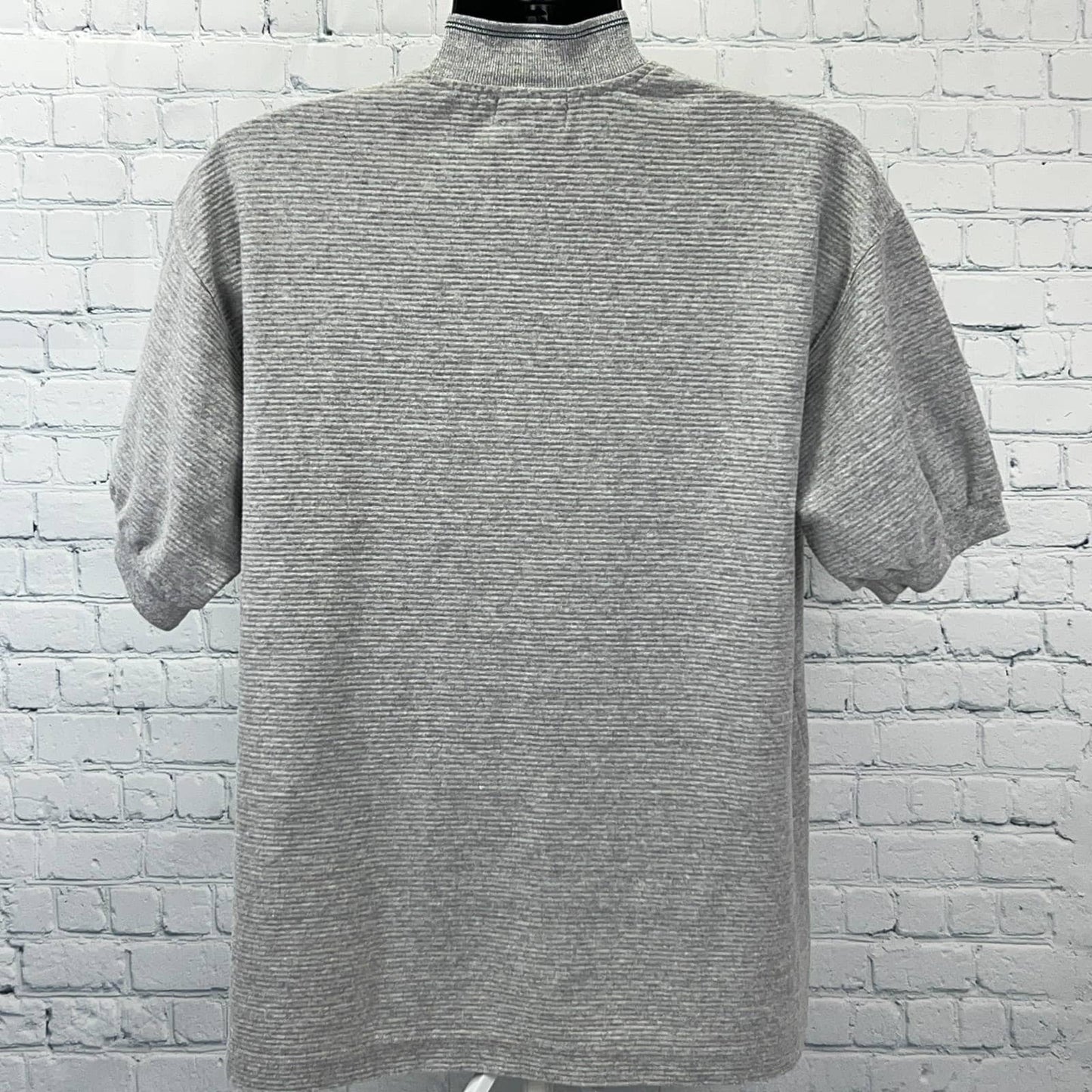 Caesars T-Shirt from the 1990s in gray, size large, back view featuring subtle stripes, noting vegas caesars palace hotel