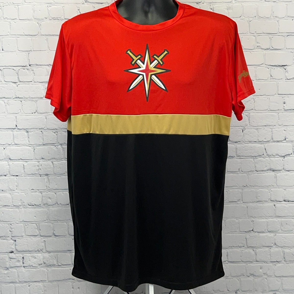 Men's red and black Golden Knights t-shirt with logo and gold stripe across the chest, front view