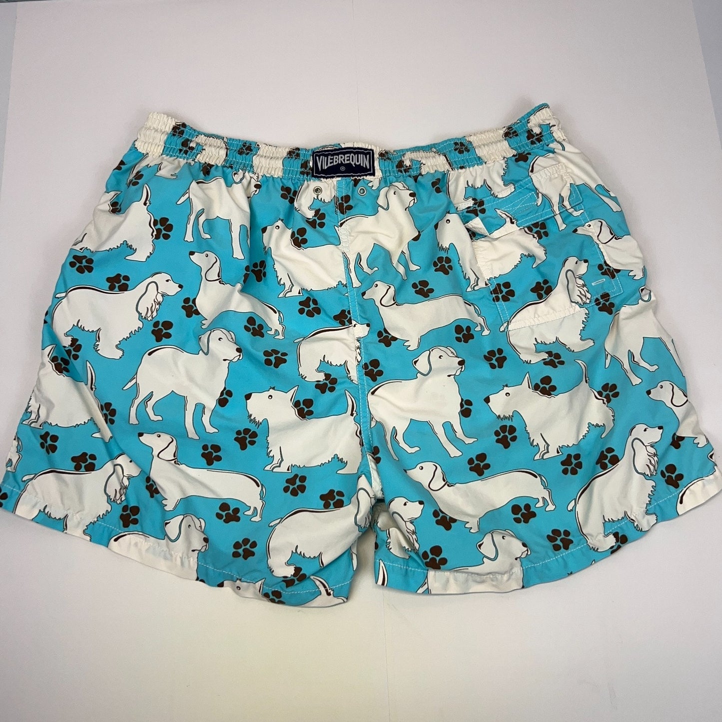 Vilebrequin Swimming Trunks in blue with a dog print, featuring an elastic waistband and mid-length design