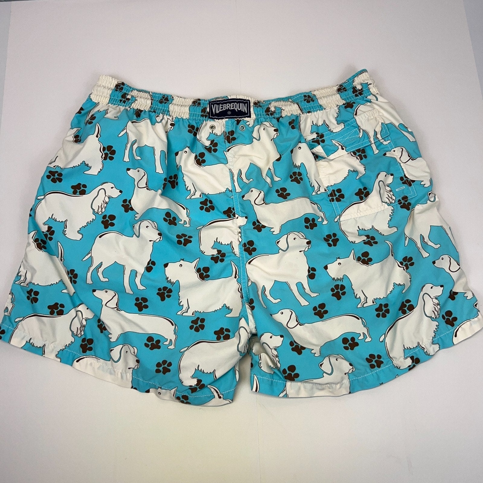 Vilebrequin Swimming Trunks in blue with a dog print, featuring an elastic waistband and mid-length design