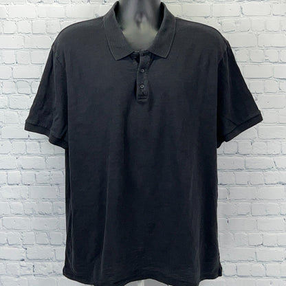 Vince Polo in black, featuring a classic fit and three-button placket, front view on a mannequin