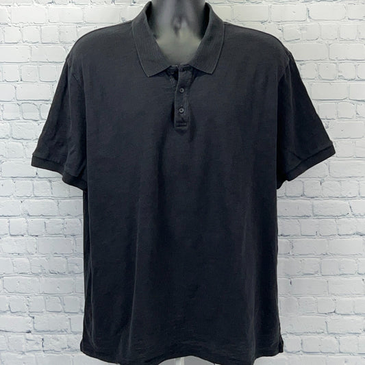 Vince Polo in black, featuring a classic fit and three-button placket, front view on a mannequin