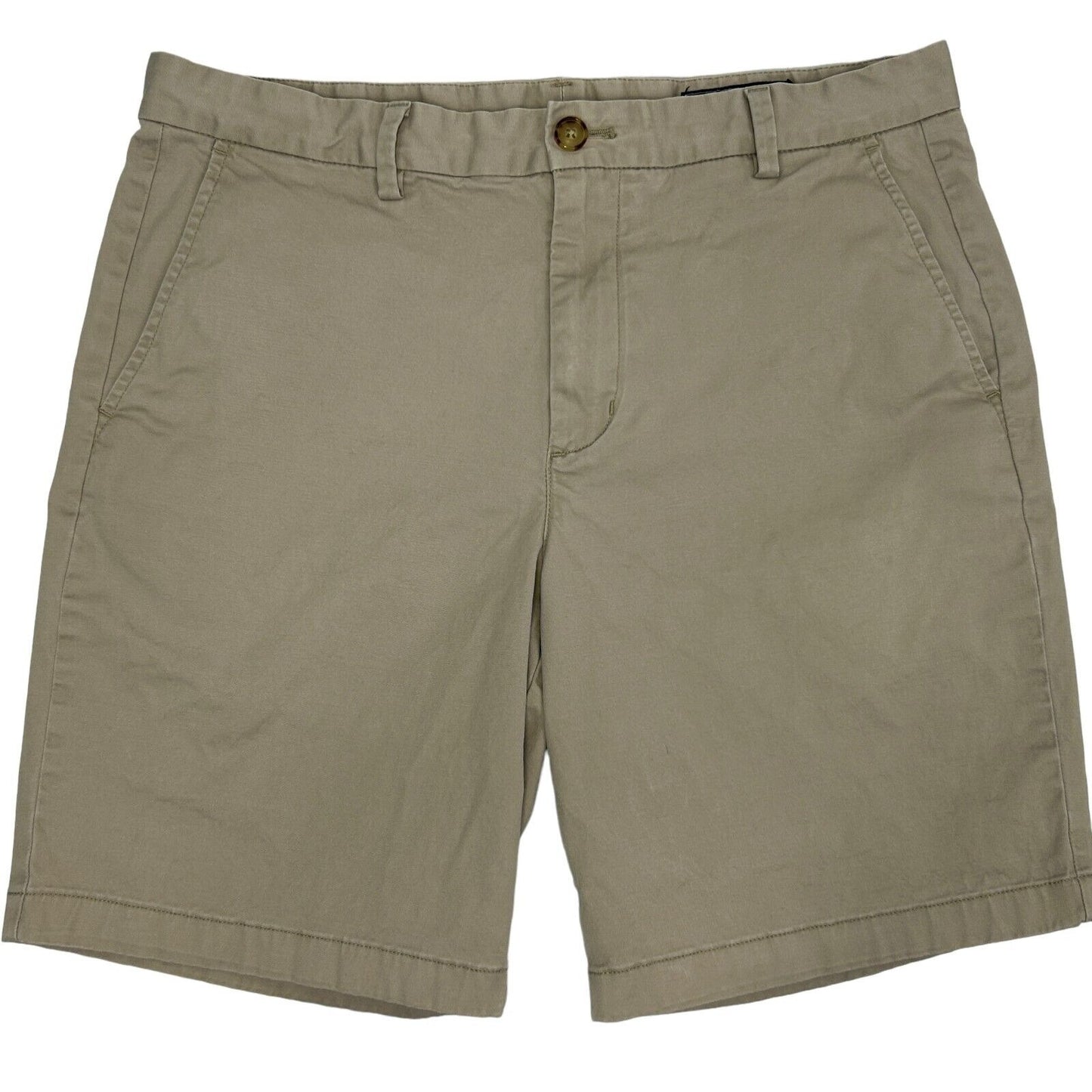 Vineyard Vines tan shorts in size medium with side pockets and button closure, front view