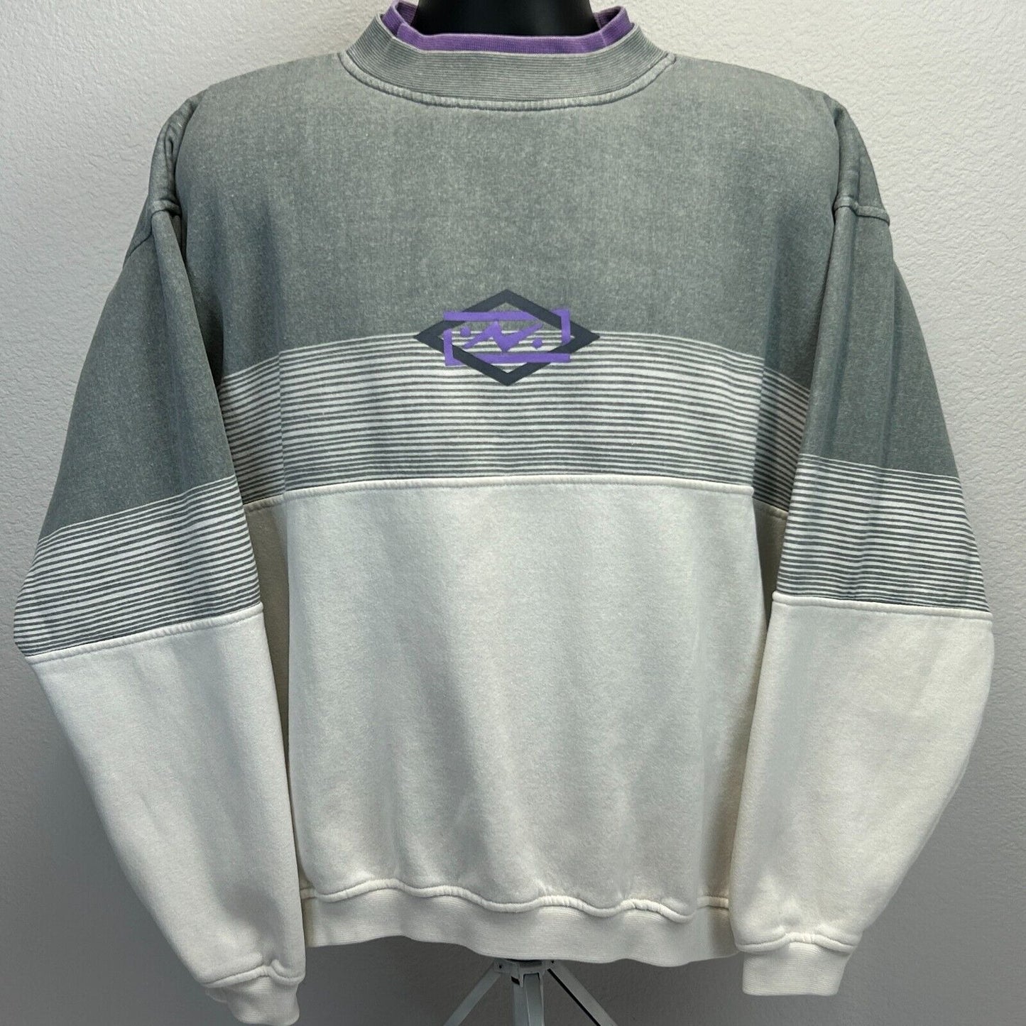 Vintage 90s oversized gray and white sweatshirt with purple logo detail on the front