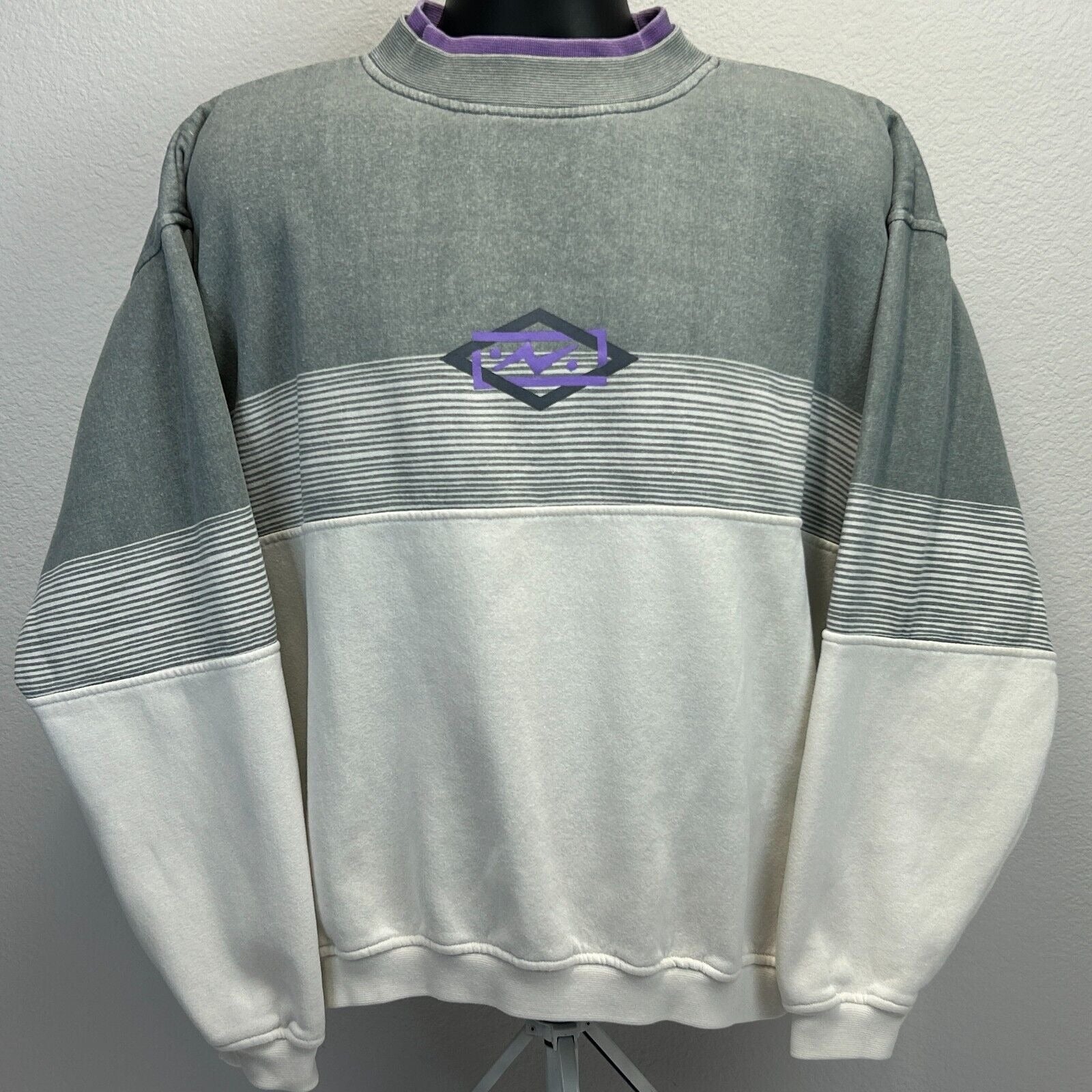 Vintage 90s oversized gray and white sweatshirt with purple logo detail on the front