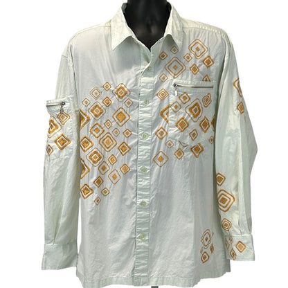 White Prestige shirt with vintage 90s orange geometric designs, featuring a chest pocket and long sleeves