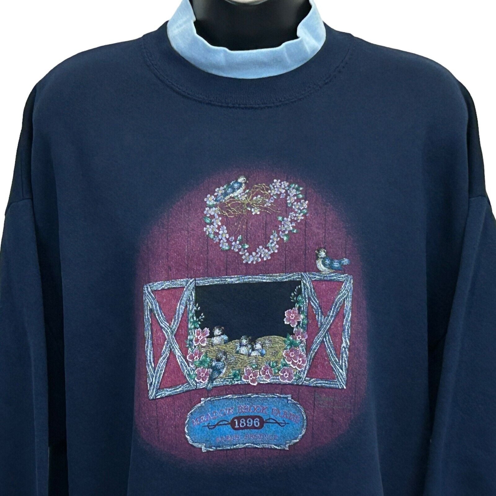 Vintage 90s navy sweatshirt with colorful floral design and heart, featuring a detailed front view
