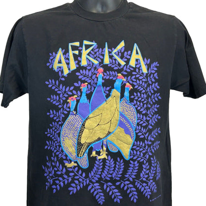Black vintage T-shirt featuring African Helmeted Guineafowl graphic with colorful 'Africa' text on the front