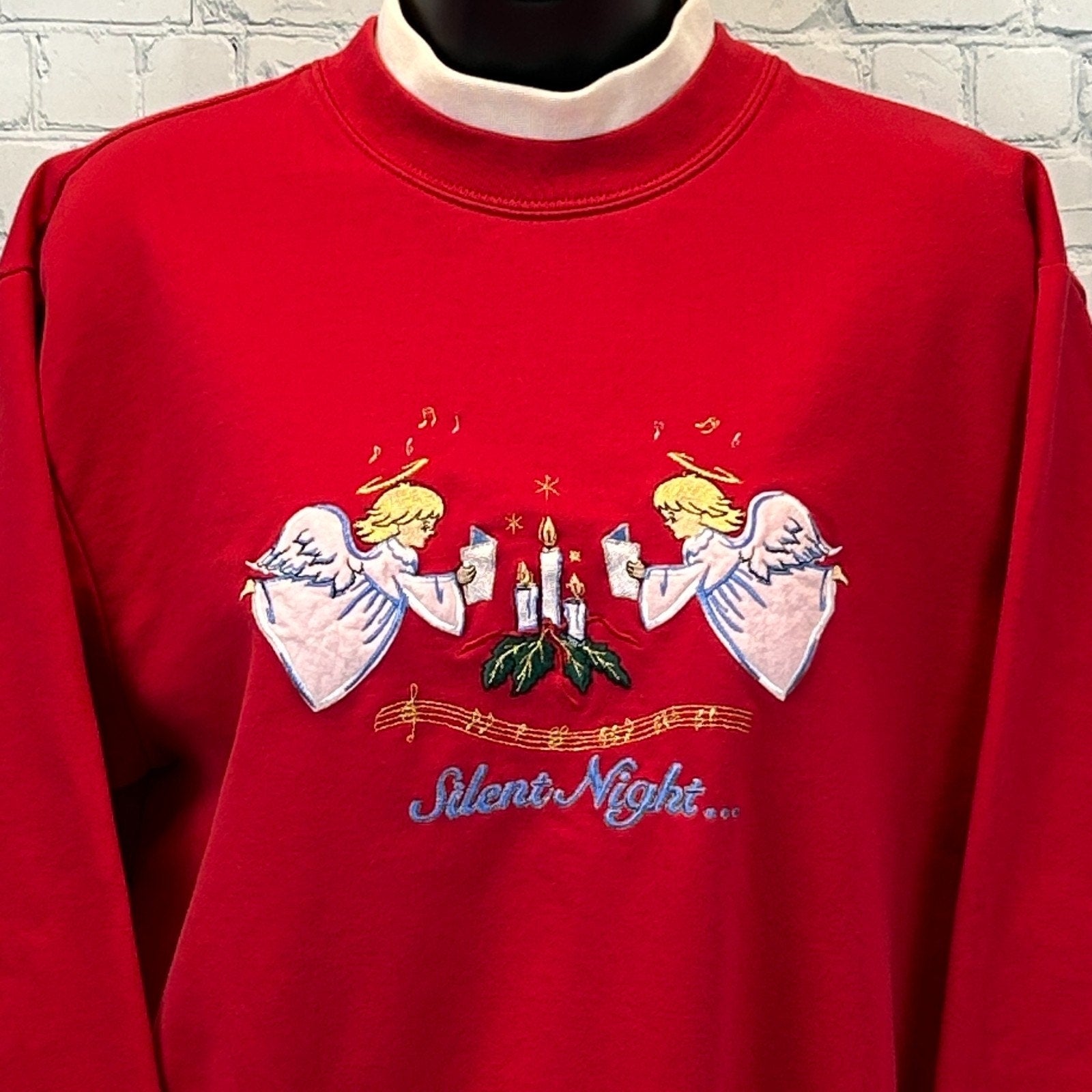 Red Bobbie Brooks Christmas Sweater featuring embroidered angels and 'Silent Night' details on the front