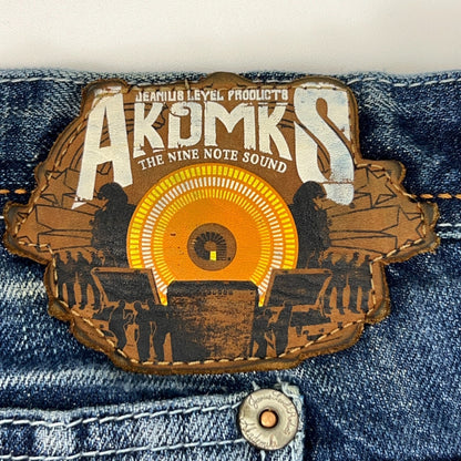 Akademiks vintage denim jeans label close-up with a colorful graphic design