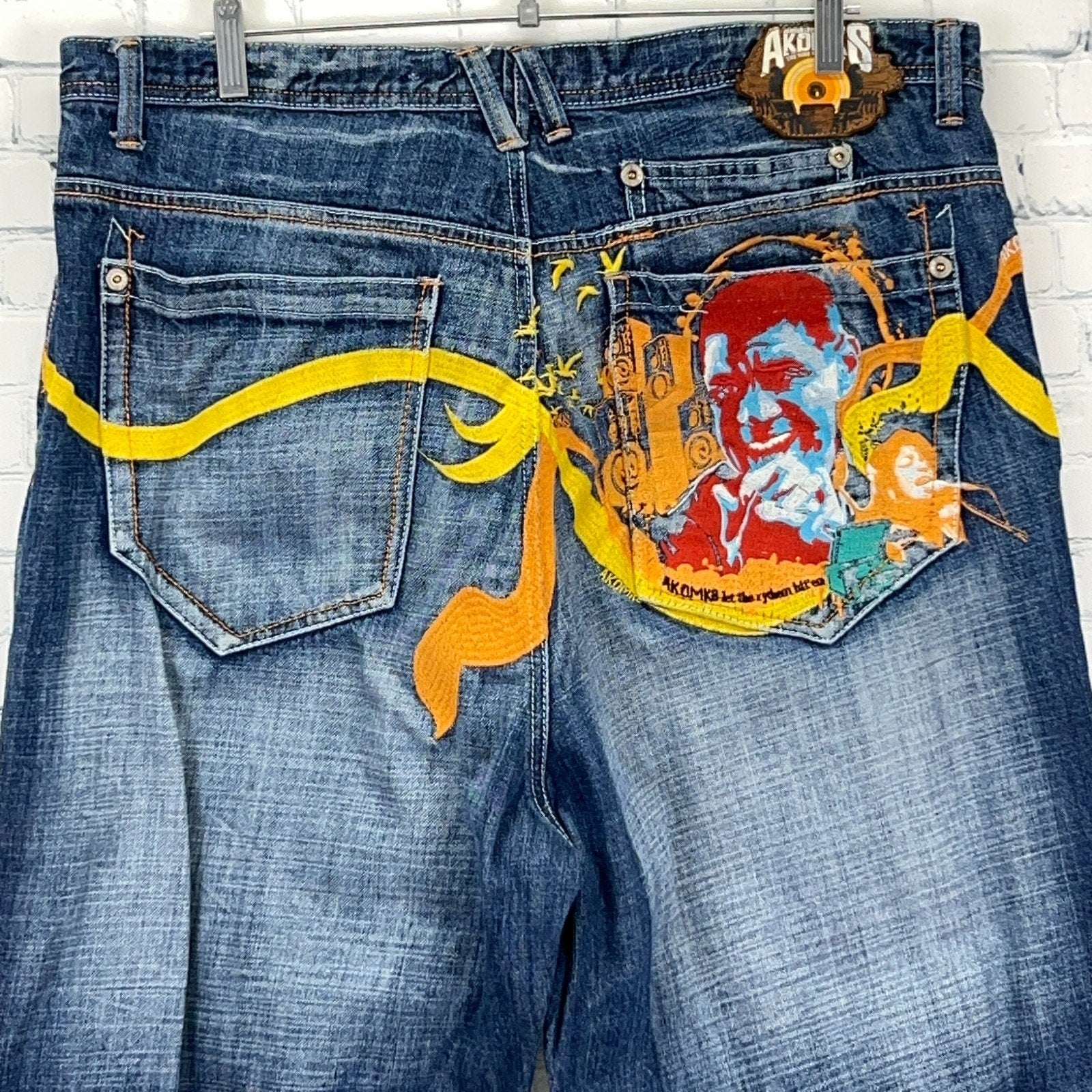 Akademiks Vintage 2000s Denim Jeans Blue Size 32 Back View with Colorful Graphic Design