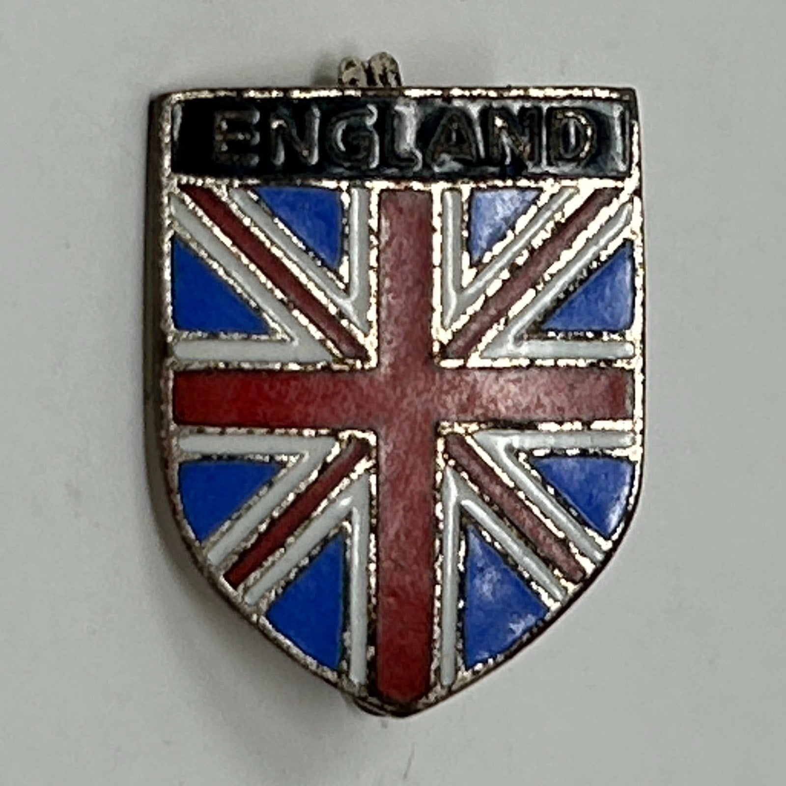 Vintage England Shield Pin featuring the Union Jack design in blue, red, and silver colors