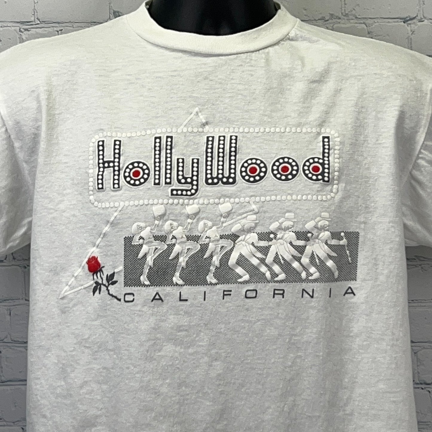Vintage white Hollywood t-shirt featuring rhinestone detail and rose graphic on the front