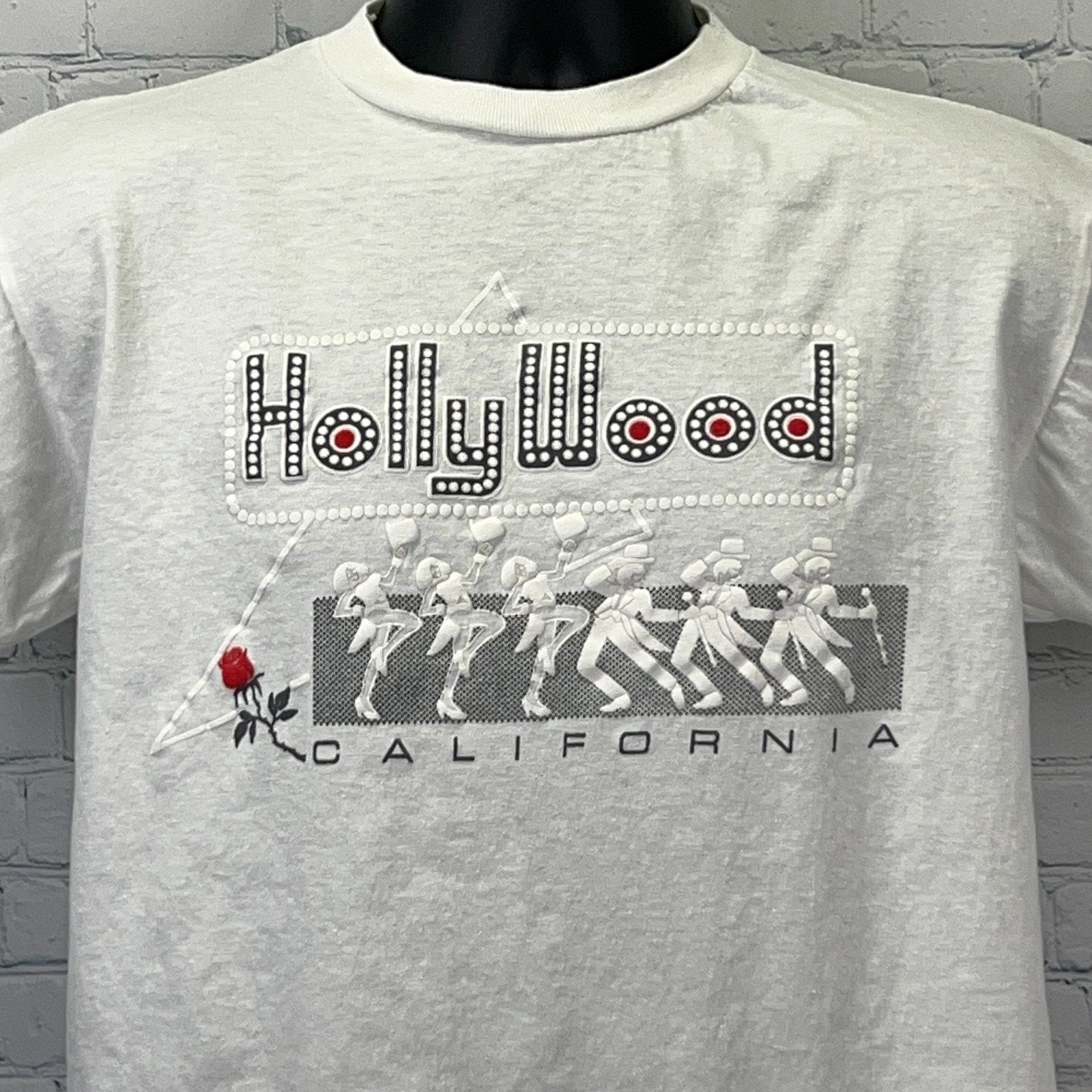 Vintage white Hollywood t-shirt featuring rhinestone detail and rose graphic on the front