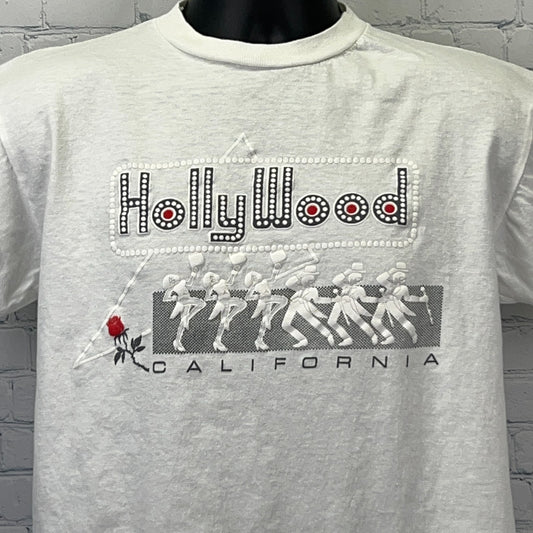 Vintage white Hollywood t-shirt featuring rhinestone detail and rose graphic on the front