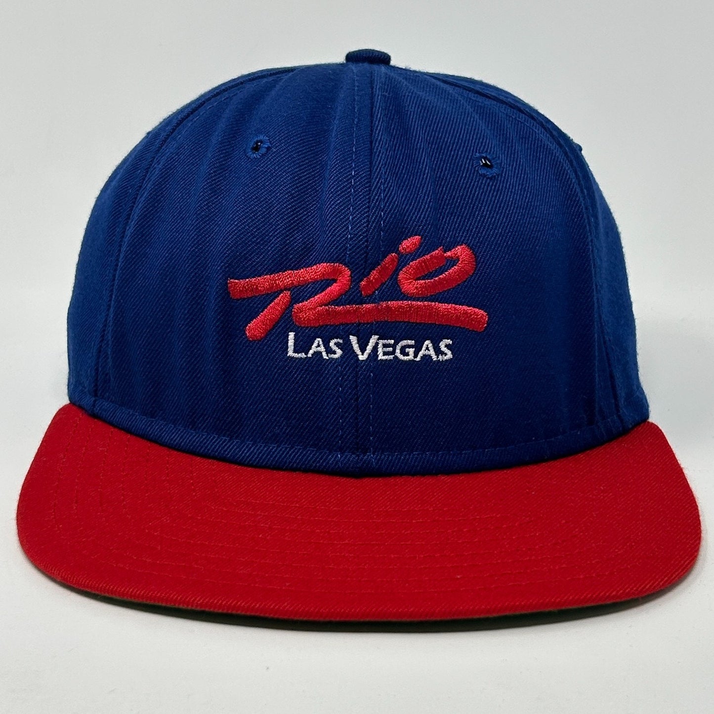 Front view of a vintage Las Vegas hat in blue and red featuring embroidered logo