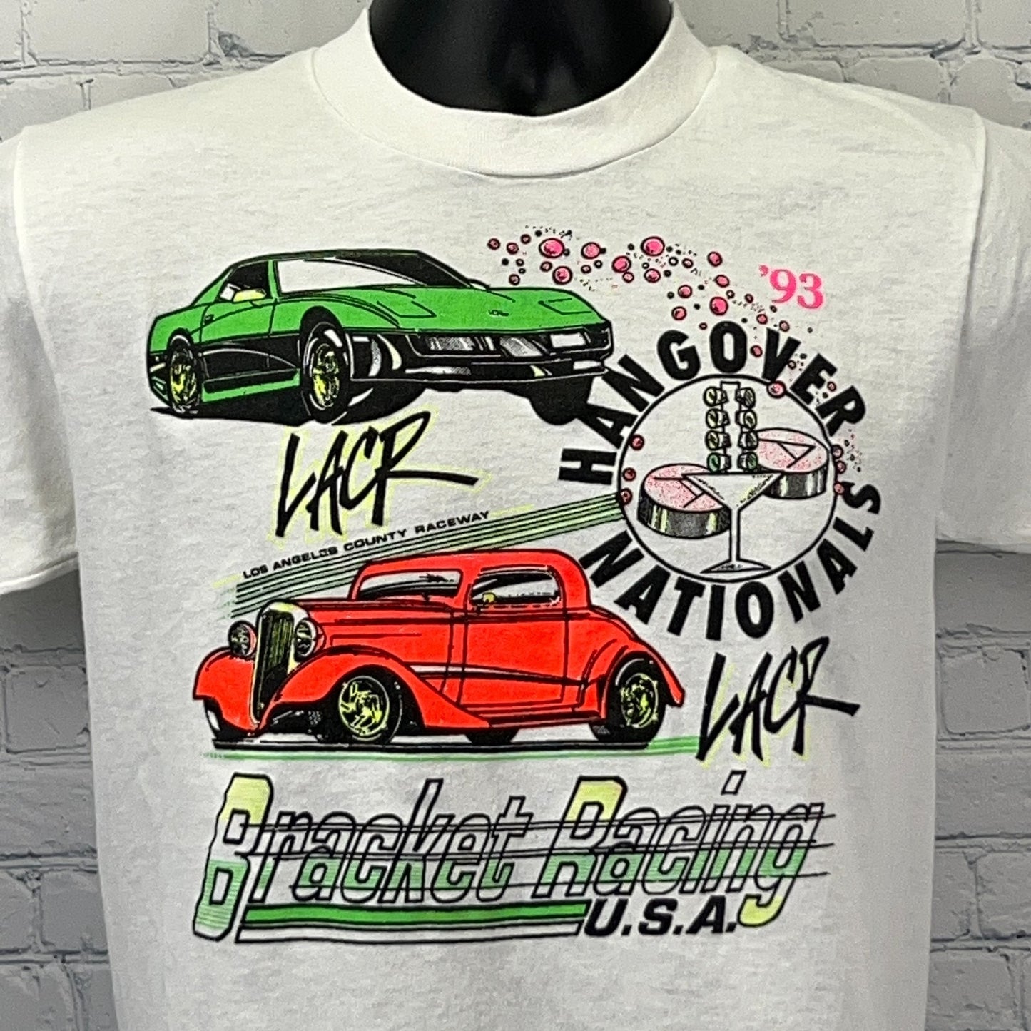 Vintage white t-shirt featuring Los Angeles County Raceway graphic with green car and red hot rod design