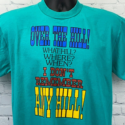 Jerzees Over the Hill Graphic T-Shirt in Teal, featuring colorful humorous text on the front