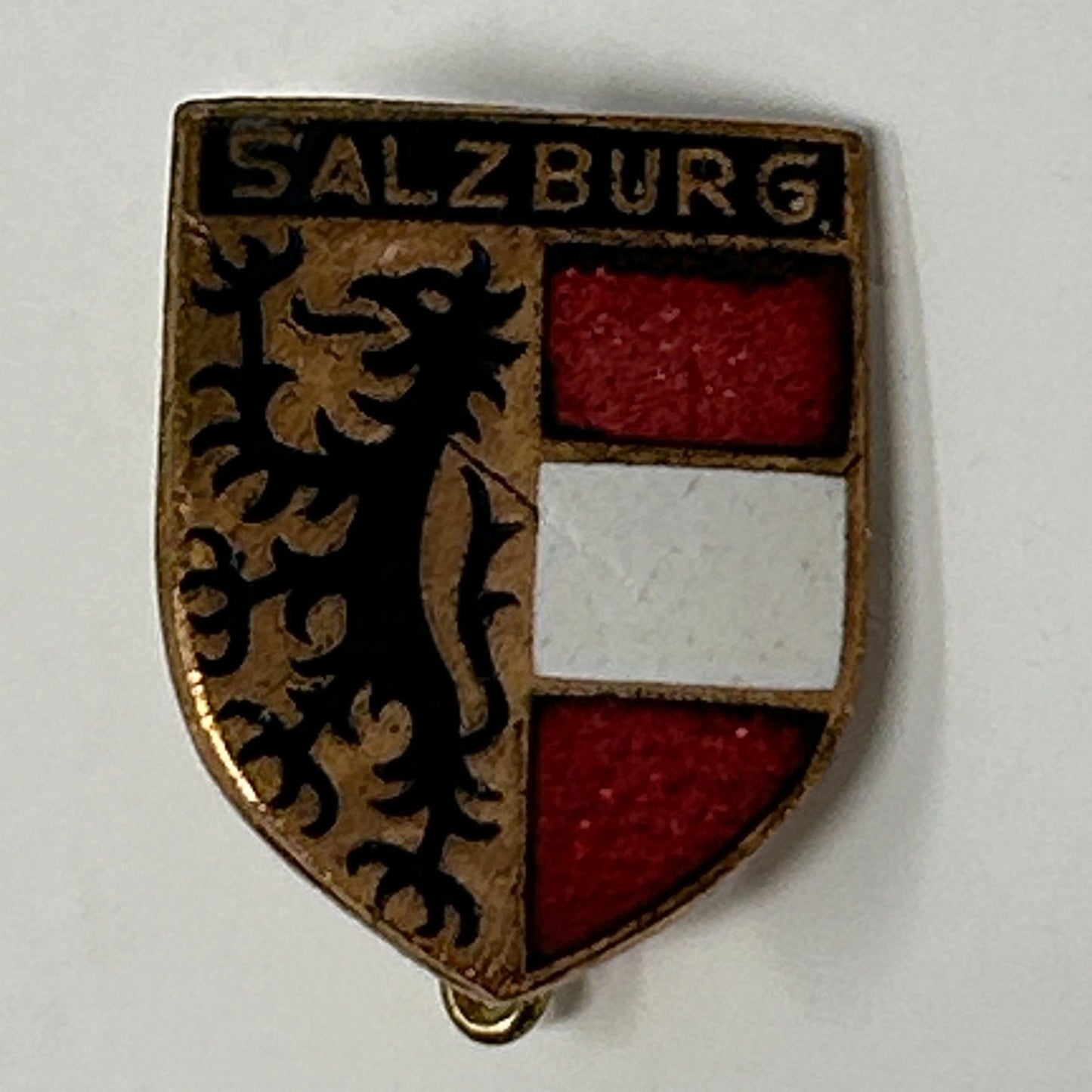 Vintage Salzburg coat of arms pin in gold with red and white enamel detailing