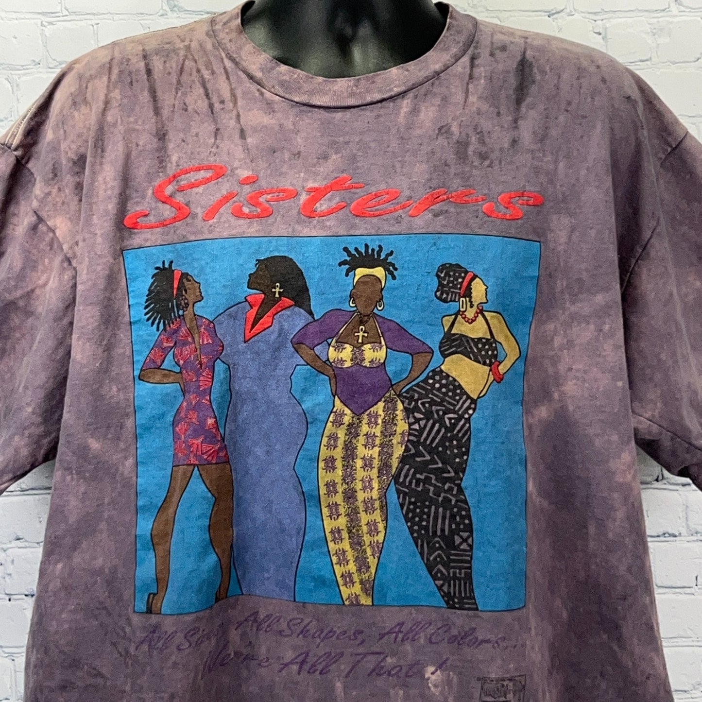 Vintage oversized purple t-shirt featuring African American women in vibrant outfits with the text 'Sisters'