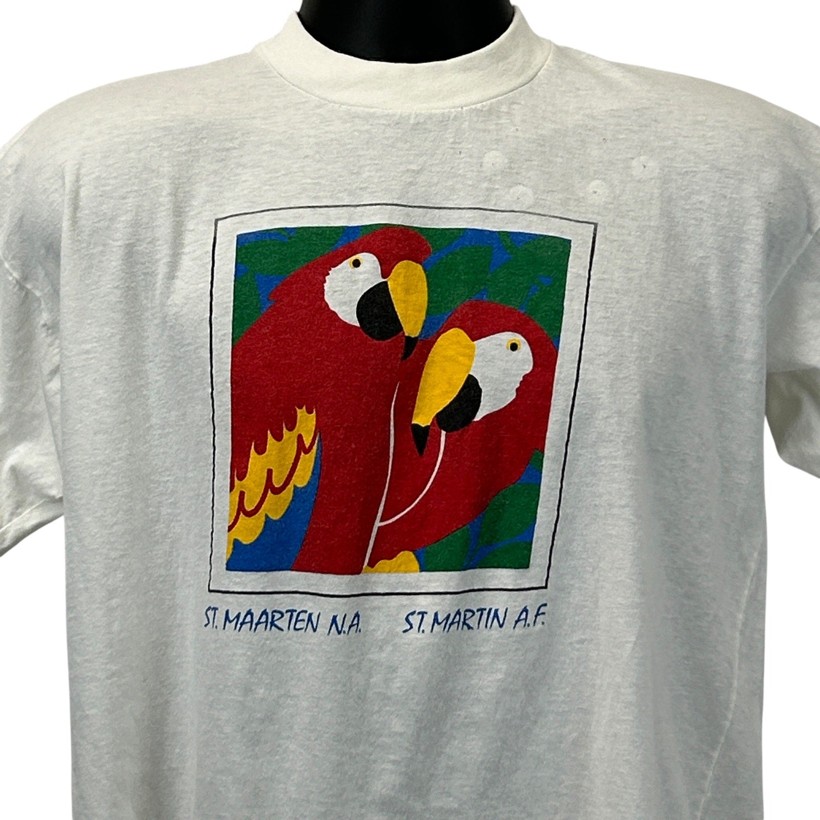 Vintage white T-shirt featuring colorful St Maarten parrots graphic design on the front