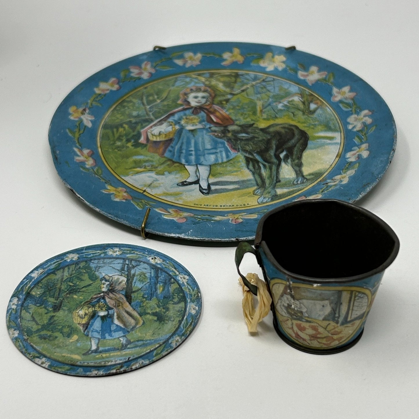 Ohio Art Vintage Tin Tea Set with Blue Floral Design, Includes Plate and Cup featuring Child and Dog Illustration