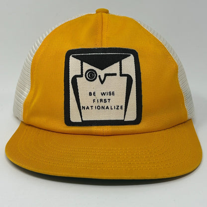 Vintage Trucker Hat in yellow with front logo reading Be Wise First Nationalize, featuring mesh back