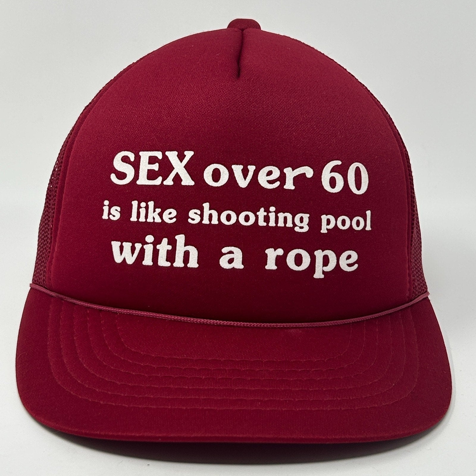 Burgundy Vintage Trucker Hat featuring a humorous text design on the front.