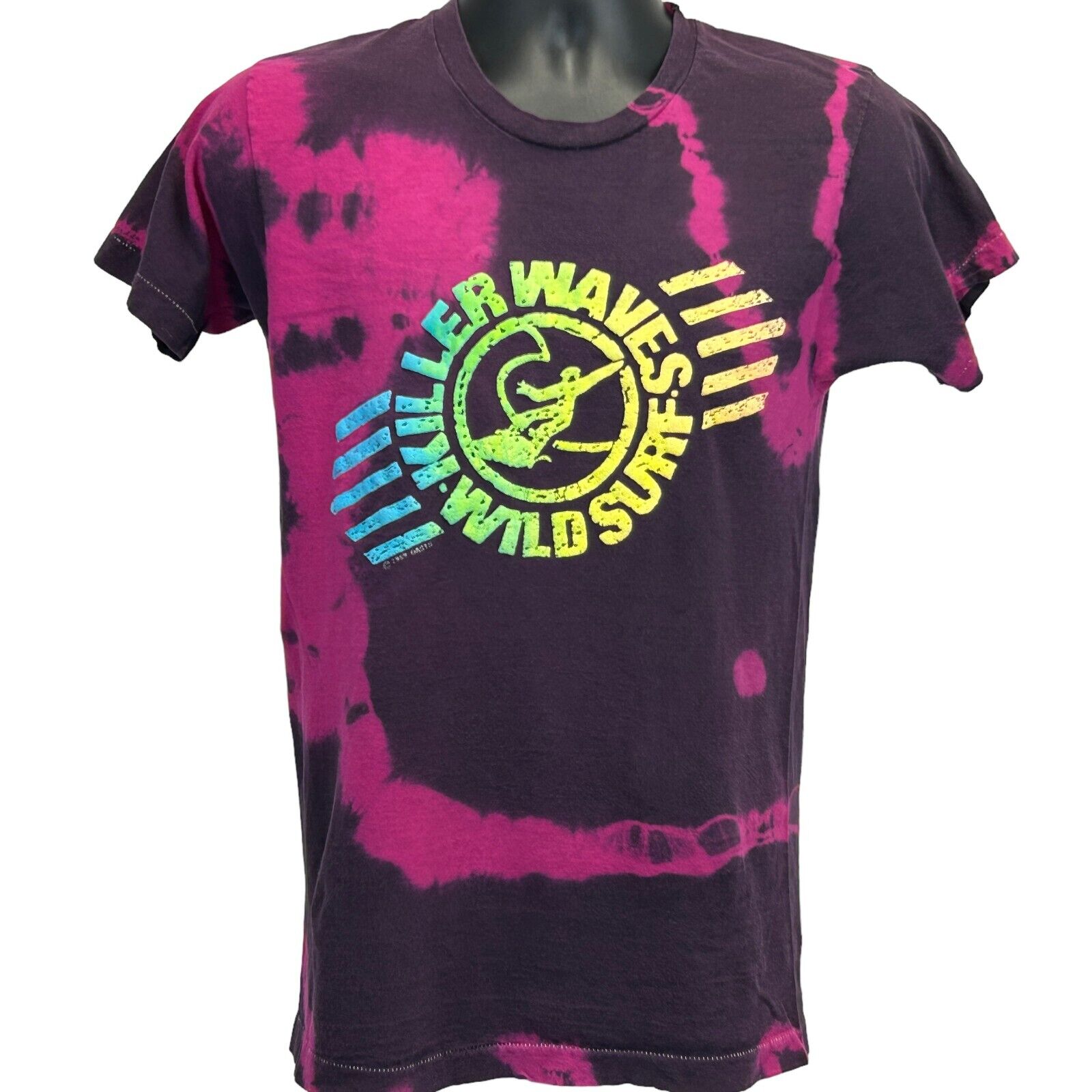 Vintage tie-dye T-shirt in black and pink featuring a surfing graphic on the front