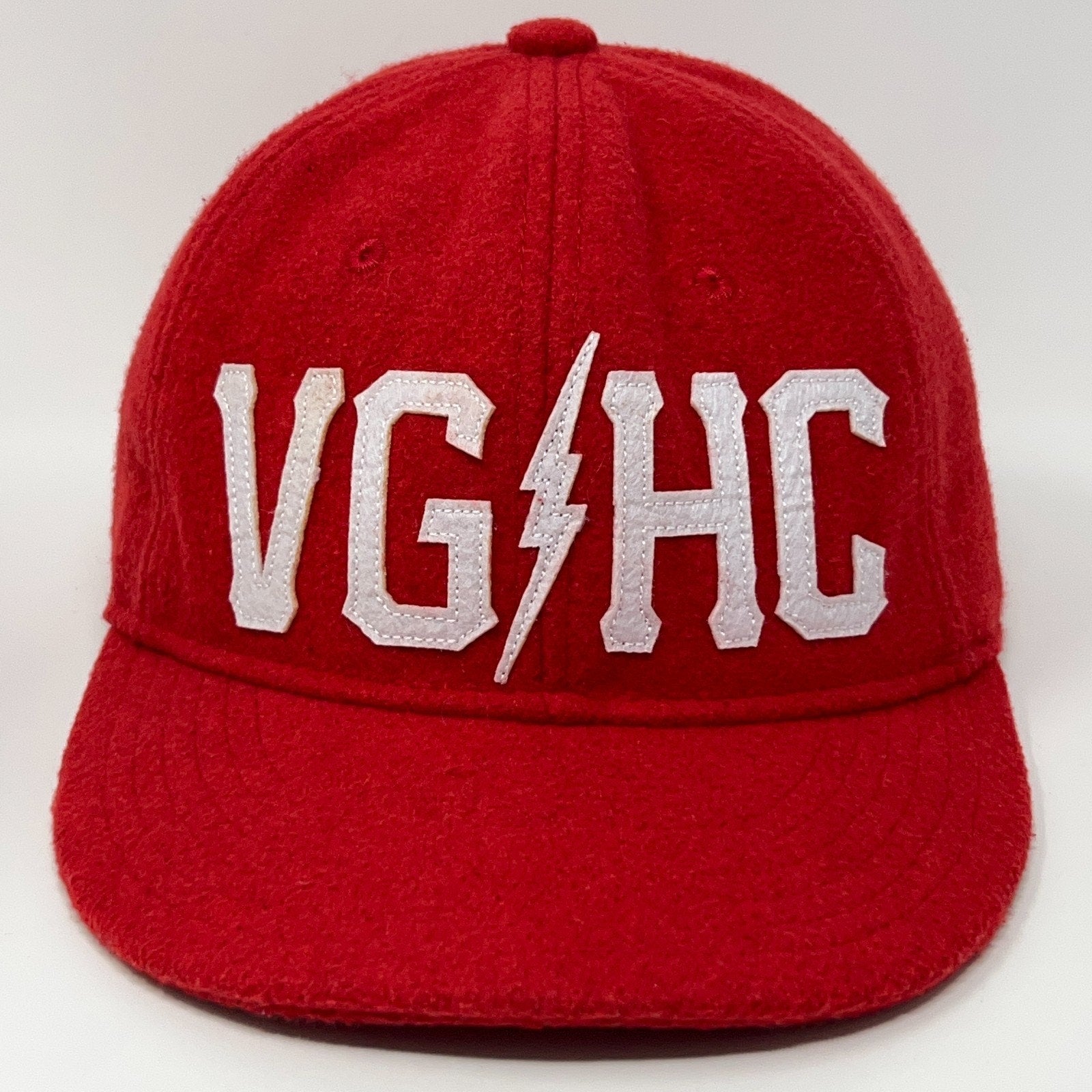Red Violent Gentlemen Hockey Club Cap with White VGHC Logo on Front for Fans