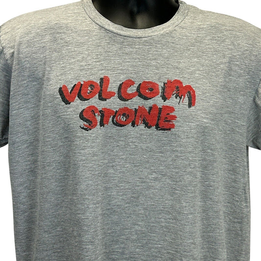 Front view of gray Volcom T-shirt featuring bold red Volcom Stone logo in a stylish design